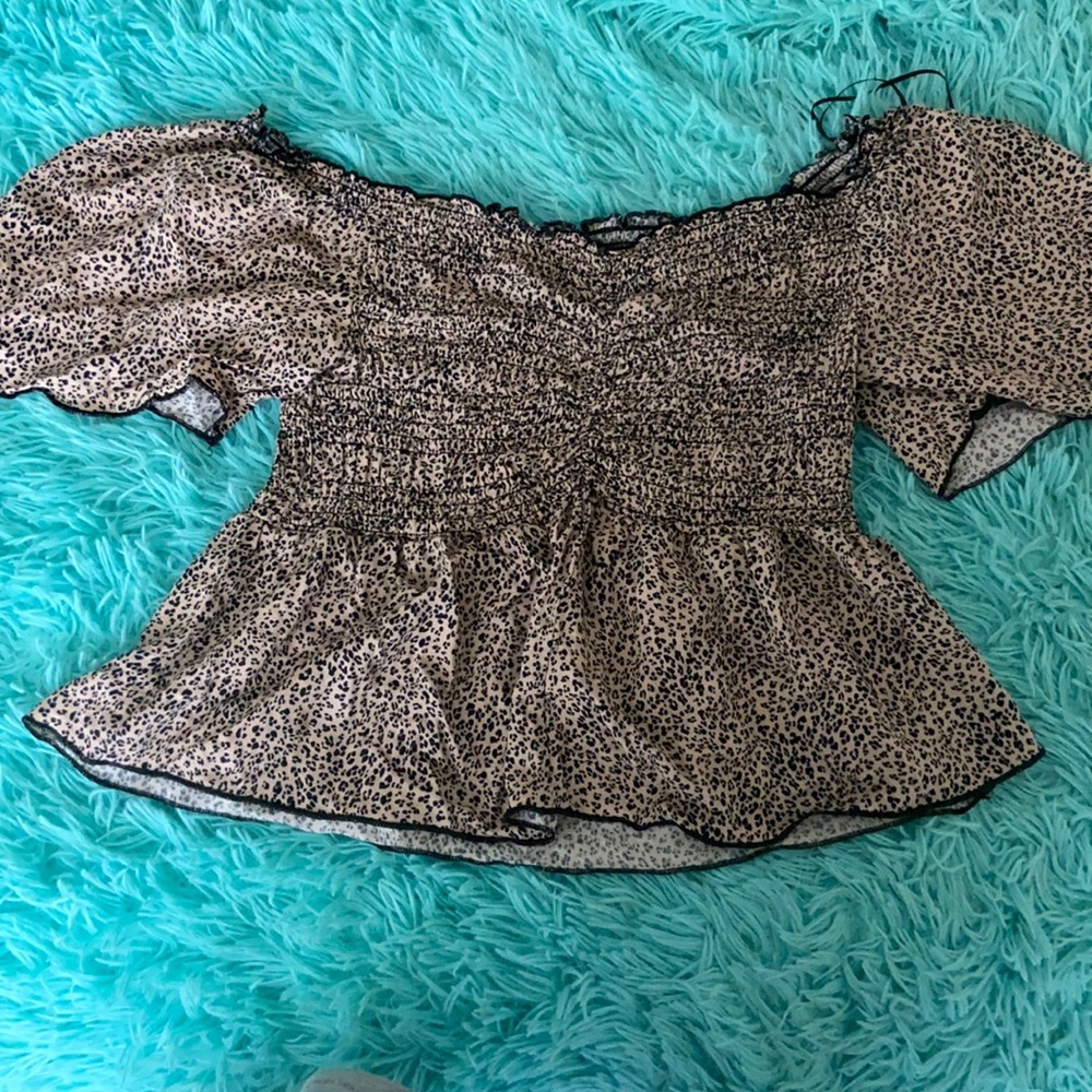 Large but smaller on, Leopard print styled shirt